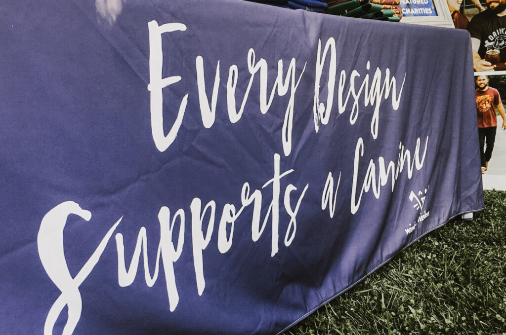 Every design supports a canine slogan printed on table cloth