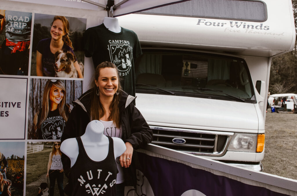 Parked RV behind tent while selling at event