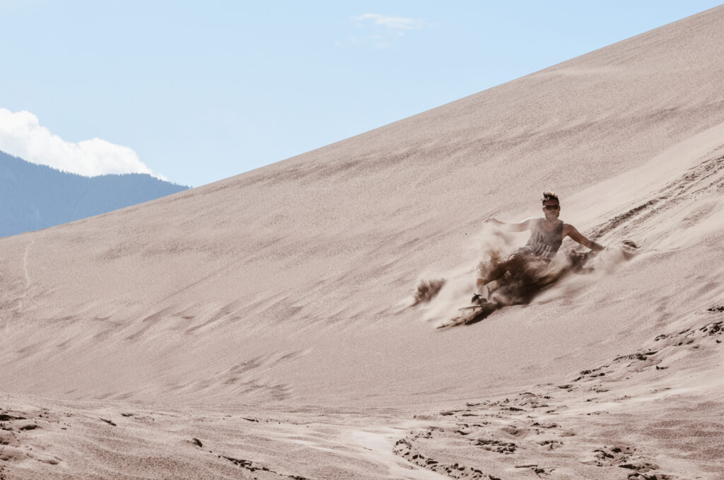 Sand Surfing at Great Sand Dunes National Park and Preserve